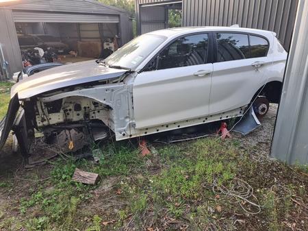 Crashed BMW one series with no wheels