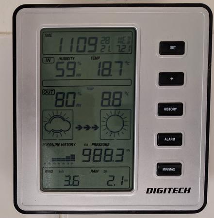 A generic brand weather station indoor unit with a LCD display
